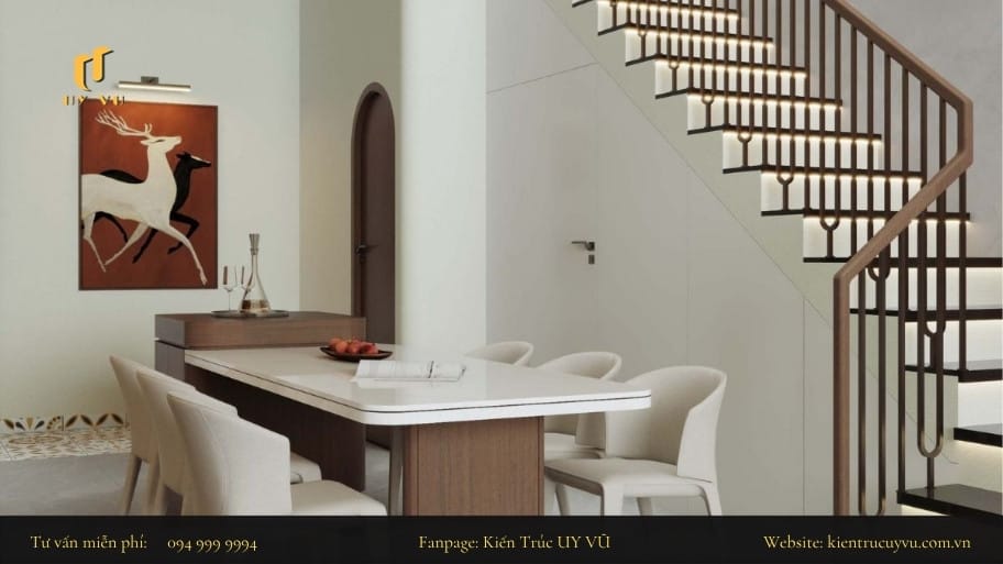 Tổng hợp các mẫu thiết kế phòng khách nhà ống có cầu thang hài hòa giữa công năng và thẩm mỹ Sự phân chia nhẹ nhành giữa khu vực phòng khách và phòng bếp